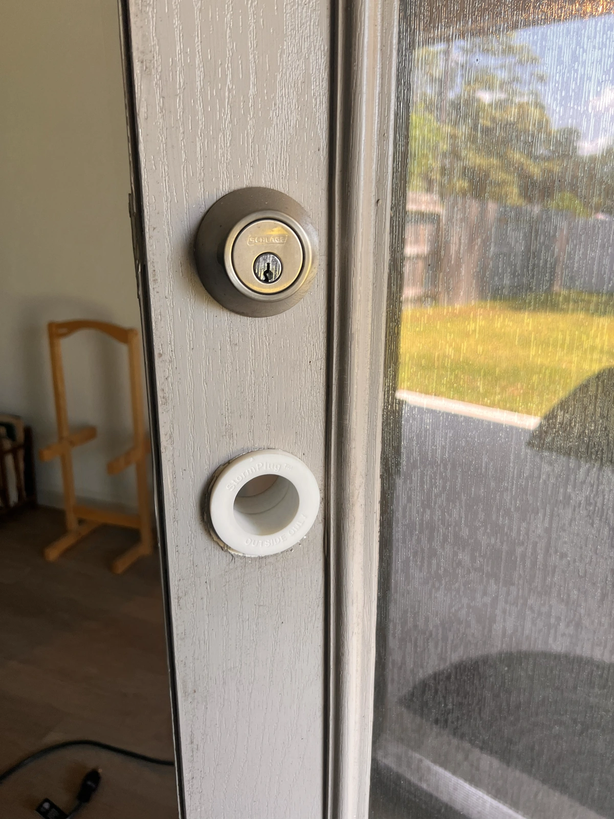 Prototype StormPlug sleeves installed through the existing door knob opening